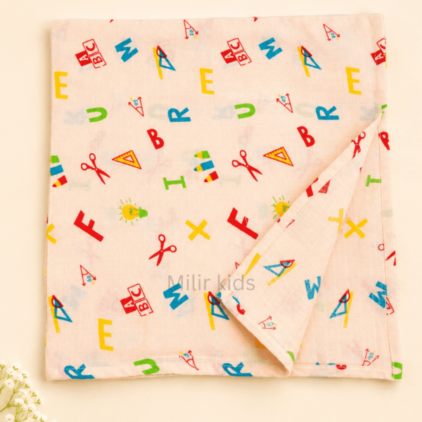 100% cotton baby muslin towel with colourful alphabet and school-themed print in 70 × 70 cm size.