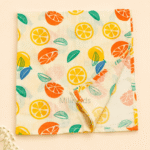 100% cotton baby muslin towel with citrus fruit print.