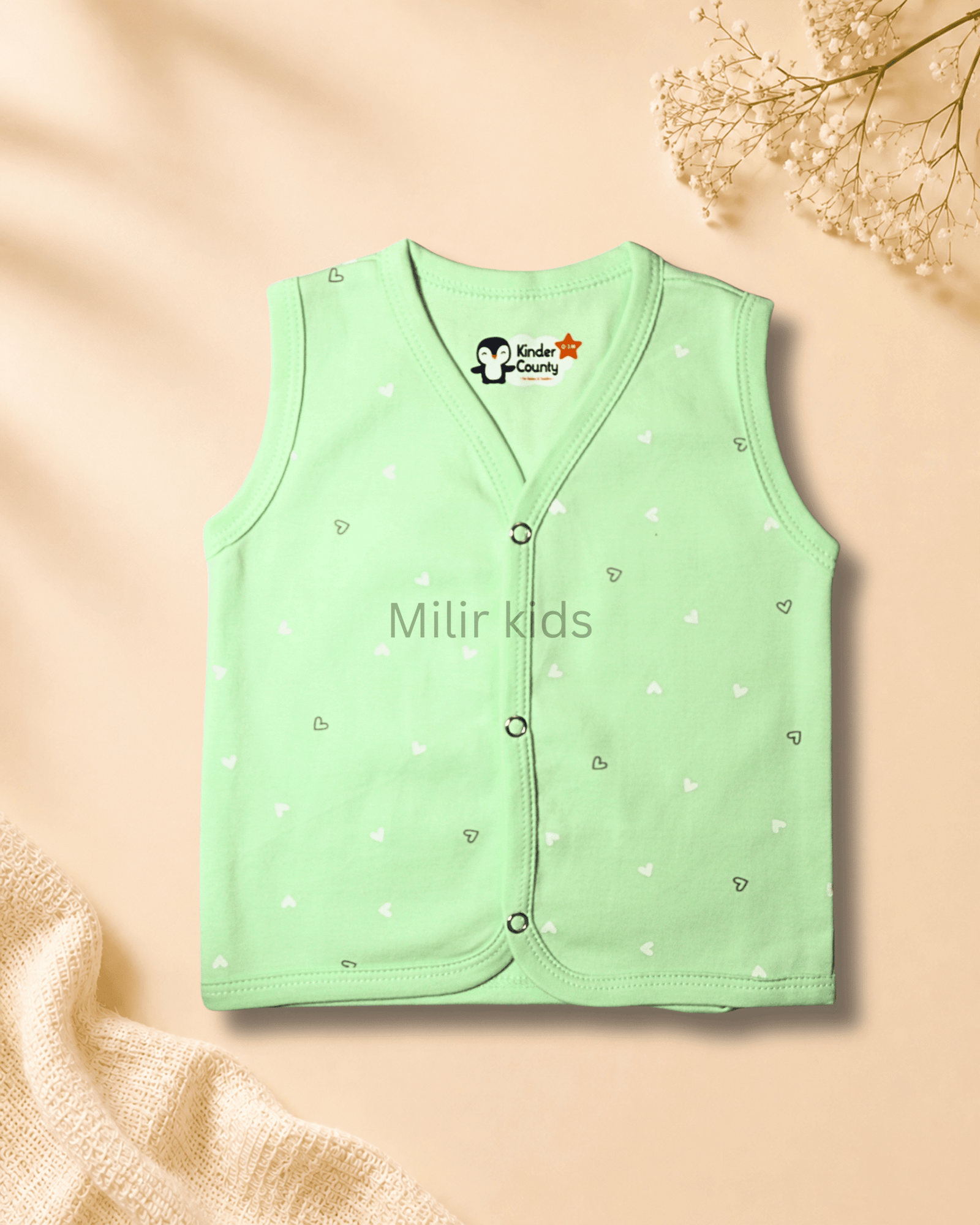 green-heart-sleeveless-baby-jabla Kinder County sleeveless cotton baby jabla for newborn babies featuring soft breathable fabric with front snap buttons.