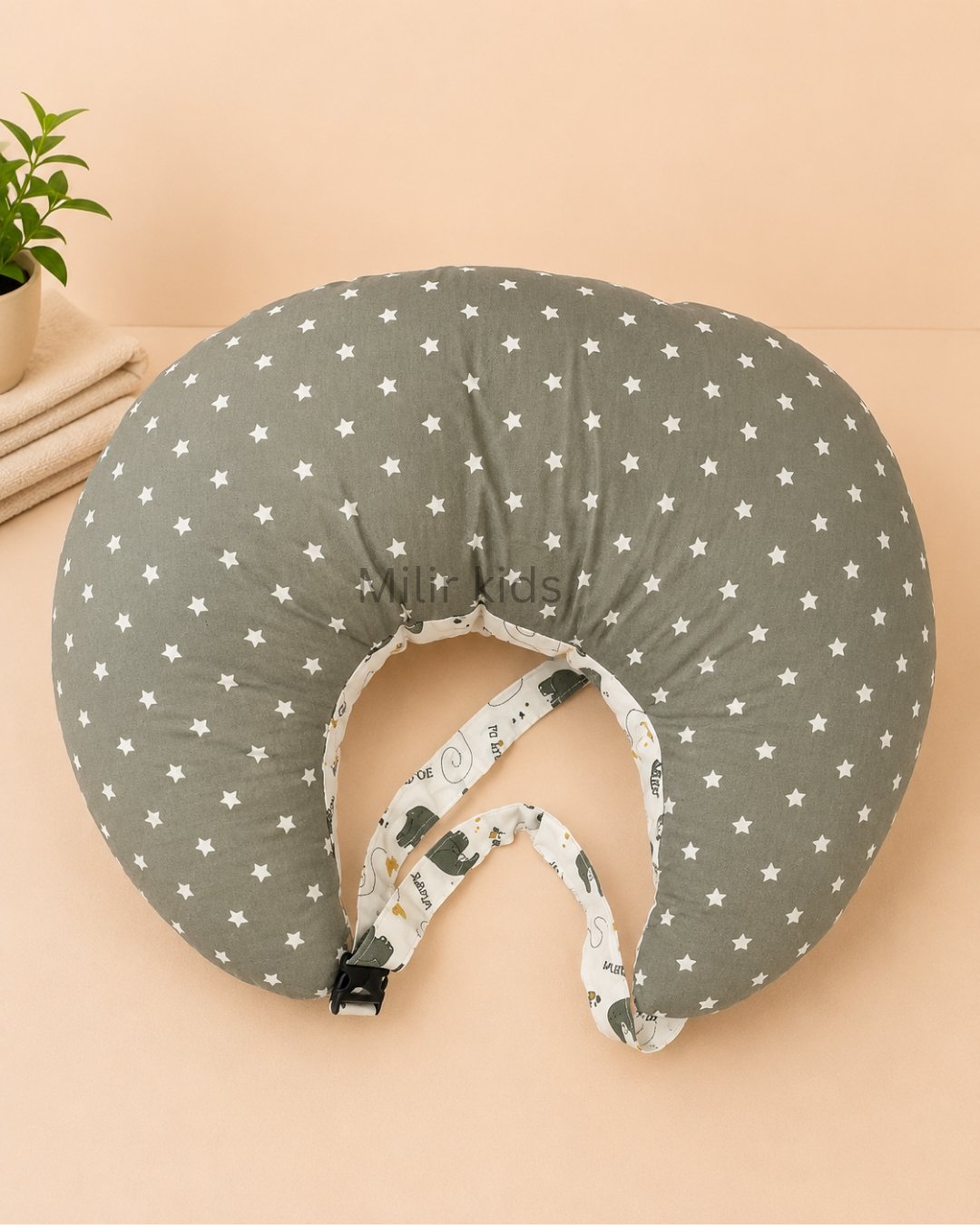 Grey elephant print baby feeding pillow with safety strap for breastfeeding and bottle feeding by Milir Kids