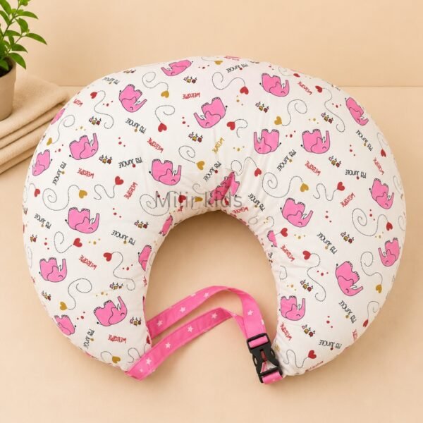 Pink baby feeding pillow with safety strap for breastfeeding and bottle feeding by Milir Kids