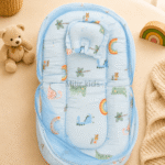 Premium muslin baby bed with mosquito net for newborn babies, soft breathable sleeping nest with head support cushion and portable design.