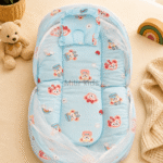 Premium muslin baby bed with mosquito net for newborn babies, soft breathable sleeping nest with head support cushion and portable design.