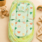 Premium muslin baby bed with mosquito net for newborn babies, soft breathable sleeping nest with head support cushion and portable design.