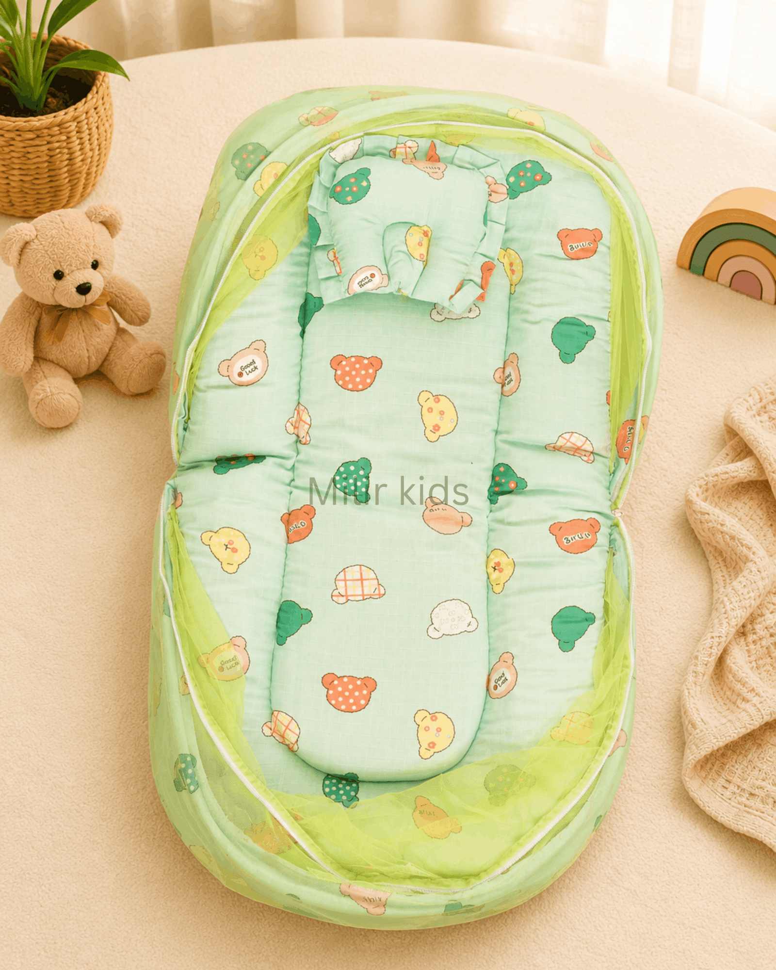 muslin-baby-bed-mosquito-net-green-bear-print Premium muslin baby bed with mosquito net for newborn babies, soft breathable sleeping nest with head support cushion and portable design.