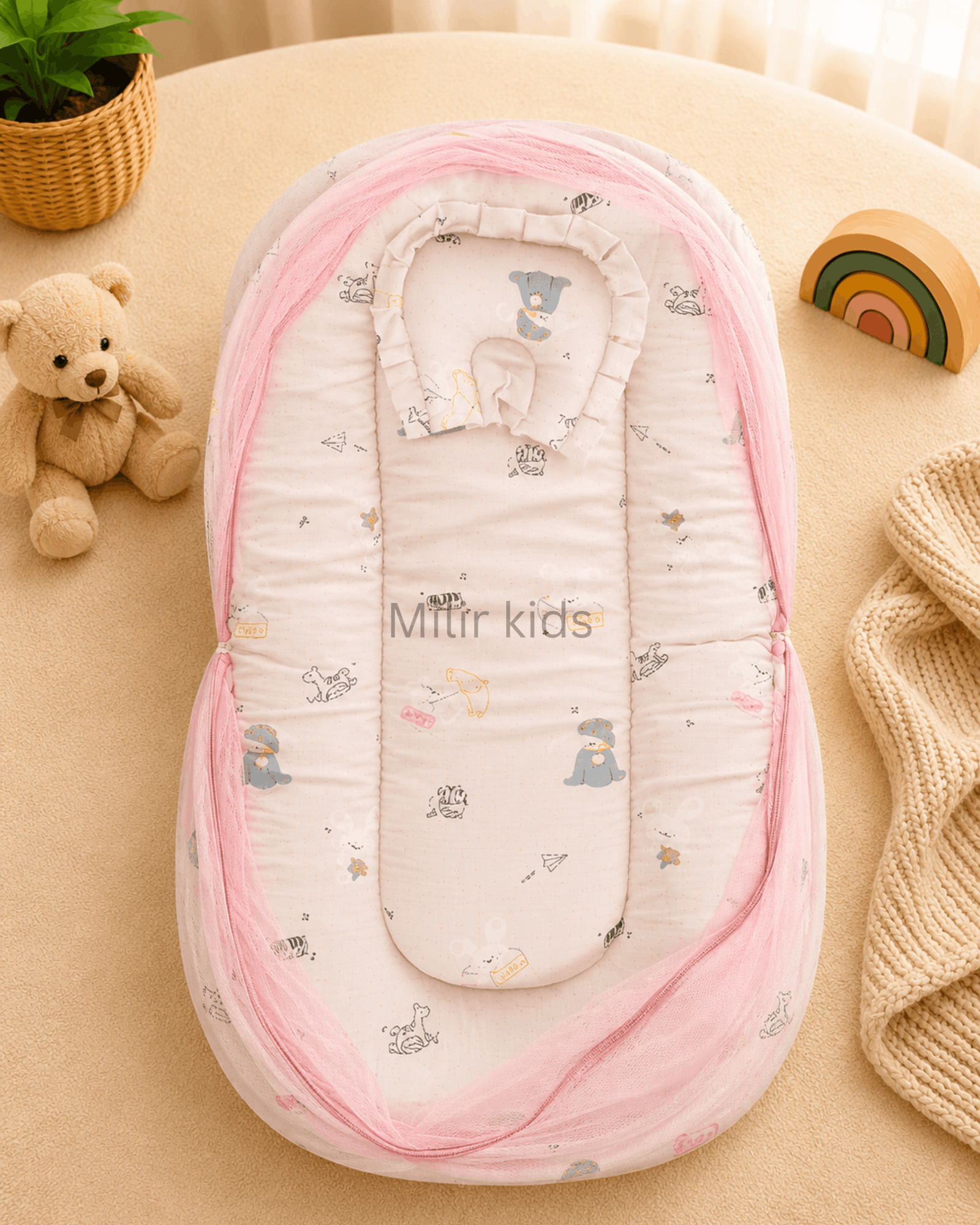 muslin-baby-bed-mosquito-net-pink-animal-print Premium muslin baby bed with mosquito net for newborn babies, soft breathable sleeping nest with head support cushion and portable design.